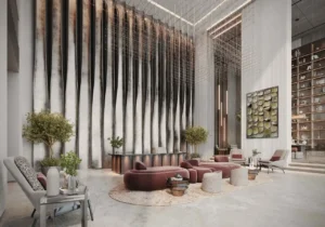 luxury lobby lounge with sculptural seating feature art wall and double height ceiling at Sunset Bay Grand by Imtiaz Dubai Islands Presented by Tohid Fetrat