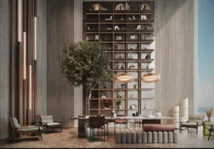 luxury lobby with double height shelving feature wall marble table and seating at Sunset Bay Grand by Imtiaz Dubai Islands Presented by Tohid Fetrat