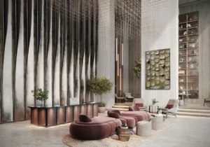 luxury lobby with sculptural seating textured feature wall and double height ceiling at Sunset Bay Grand by Imtiaz Dubai Islands Presented by Tohid Fetrat