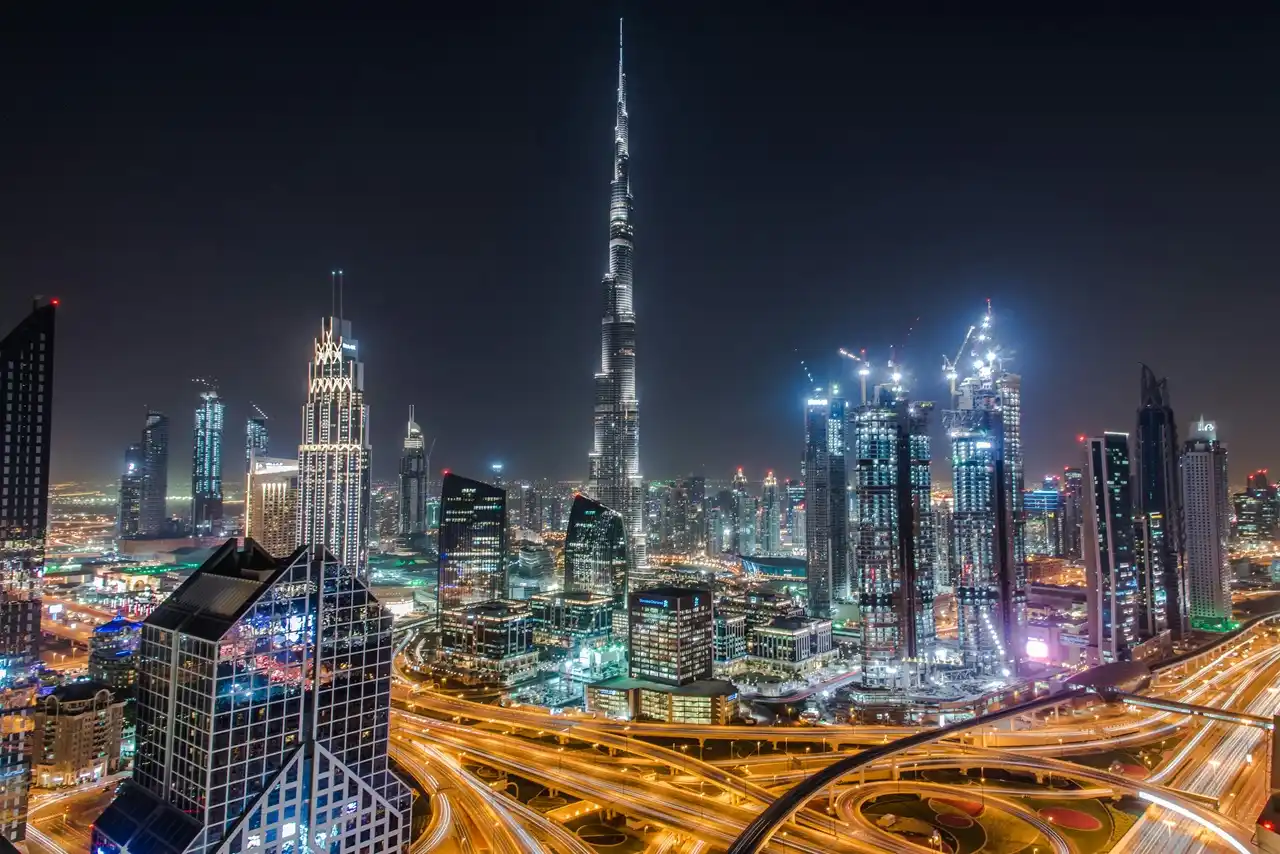 Tenant insurance in Dubai and common mistakes tenants make with skyline view of Downtown Dubai at night highlighting urban living risks Presented by Tohid Fetrat