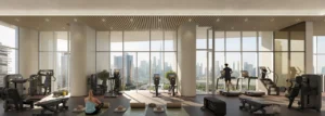 Artistry Two Residences by Select Group gym fitness area with modern equipment and floor to ceiling windows overlooking Dubai skyline in Dubai - Presented by Tohid Fetrat