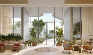Artistry Two Residences by Select Group lobby interior with lounge seating and garden view through floor to ceiling windows in Dubai - Presented by Tohid Fetrat