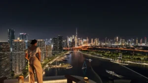 Artistry Two Residences by Select Group waterfront skyline night view with illuminated Dubai skyline and marina in Dubai - Presented by Tohid Fetrat