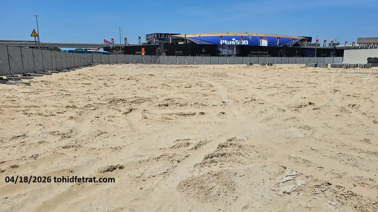 Avarra by Palace construction update April 2026 showing cleared sandy plot and perimeter fencing in Business Bay Dubai captured by Tohid Fetrat