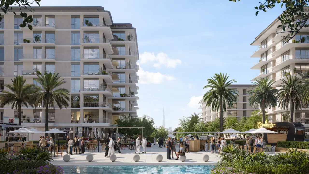 Avonlea at Rashid Yachts & Marina by Emaar landscaped community promenade with cafes, palm trees, and modern residential buildings in Dubai Presented by Tohid Fetrat