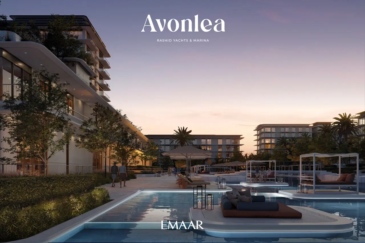Avonlea at Rashid Yachts & Marina by Emaar luxury pool deck with lounge cabanas and residential buildings at sunset in Dubai Presented by Tohid Fetrat