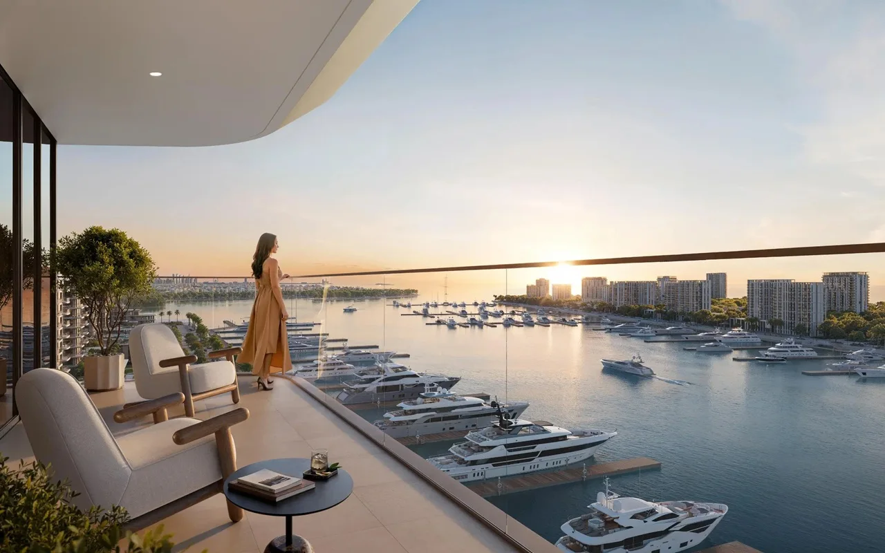 Baystar by Vida at Rashid Yachts & Marina by Emaar balcony with seating overlooking marina yachts and sunset waterfront skyline in Dubai - Presented by Tohid Fetrat