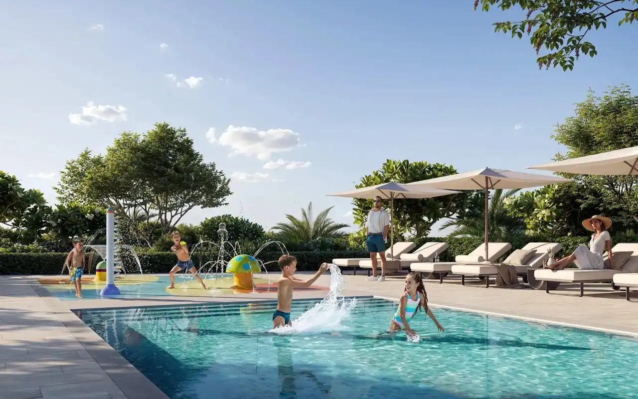 Baystar by Vida at Rashid Yachts & Marina by Emaar family pool area with children playing water features sun loungers and landscaped surroundings in Dubai - Presented by Tohid Fetrat
