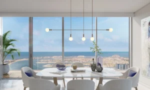 Beach Isle at Emaar Beachfront by Emaar dining area with floor to ceiling windows overlooking Palm Jumeirah and Gulf in Dubai - Presented by Tohid Fetrat