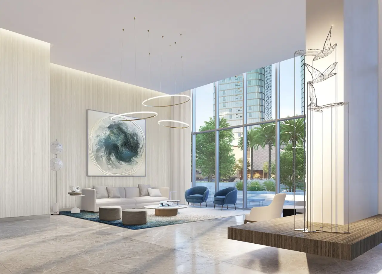 Beach Isle at Emaar Beachfront by Emaar lobby interior with double height ceiling modern seating and floor to ceiling windows in Dubai - Presented by Tohid Fetrat
