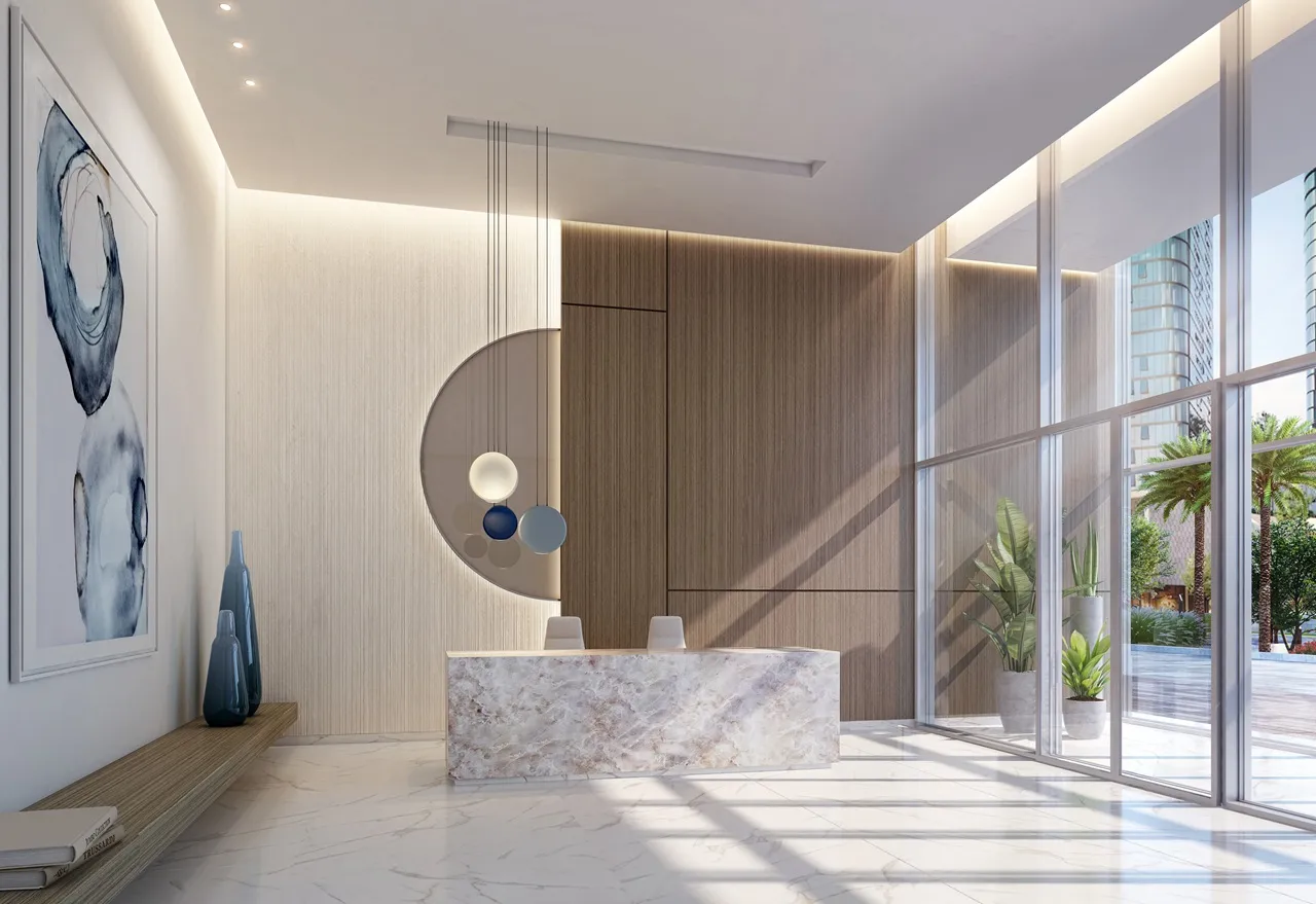 Beach Isle at Emaar Beachfront by Emaar reception lobby with marble desk modern lighting and floor to ceiling windows in Dubai - Presented by Tohid Fetrat