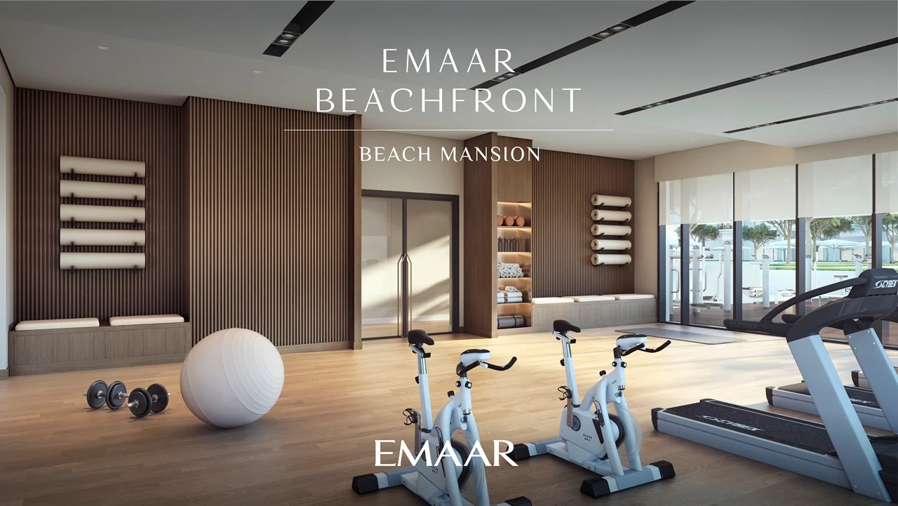 Beach Mansion at Emaar Beachfront by Emaar indoor gym with fitness equipment and modern training space in Dubai Presented by Tohid Fetrat