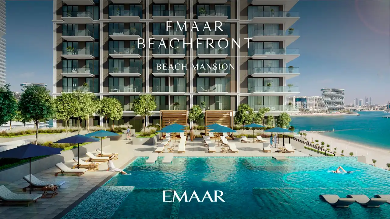 Beach Mansion at Emaar Beachfront by Emaar pool deck with beachfront views and sun loungers in Dubai Presented by Tohid Fetrat