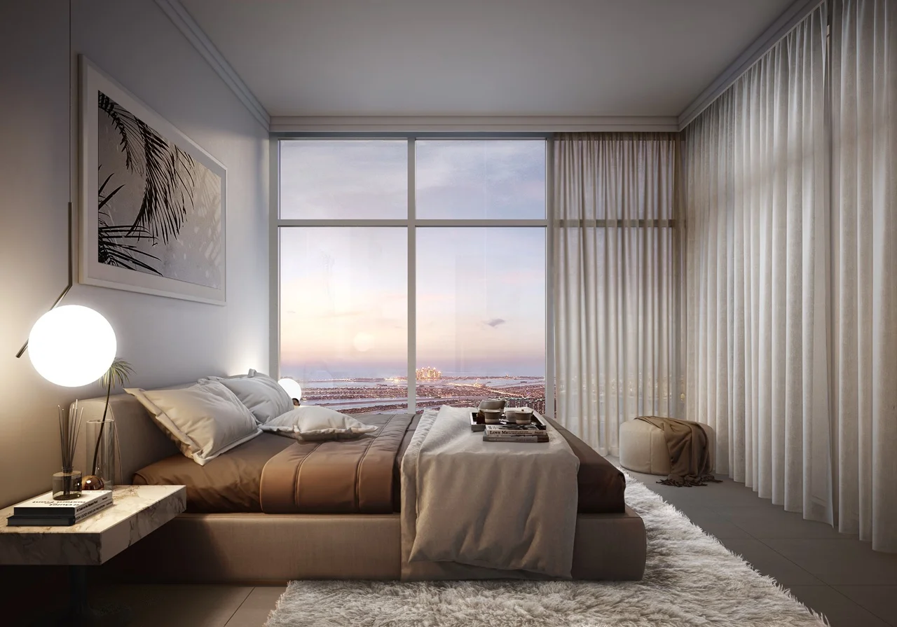 Beach Vista at Emaar Beachfront by Emaar bedroom interior with soft lighting modern furnishings and panoramic sea view through large windows in Dubai - Presented by Tohid Fetrat