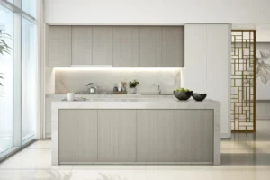 Beach Vista at Emaar Beachfront by Emaar modern kitchen interior with marble island built in cabinets and soft lighting in Dubai - Presented by Tohid Fetrat