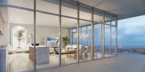 Beach Vista at Emaar Beachfront by Emaar open plan living and dining area with floor to ceiling glass walls and sea view in Dubai - Presented by Tohid Fetrat