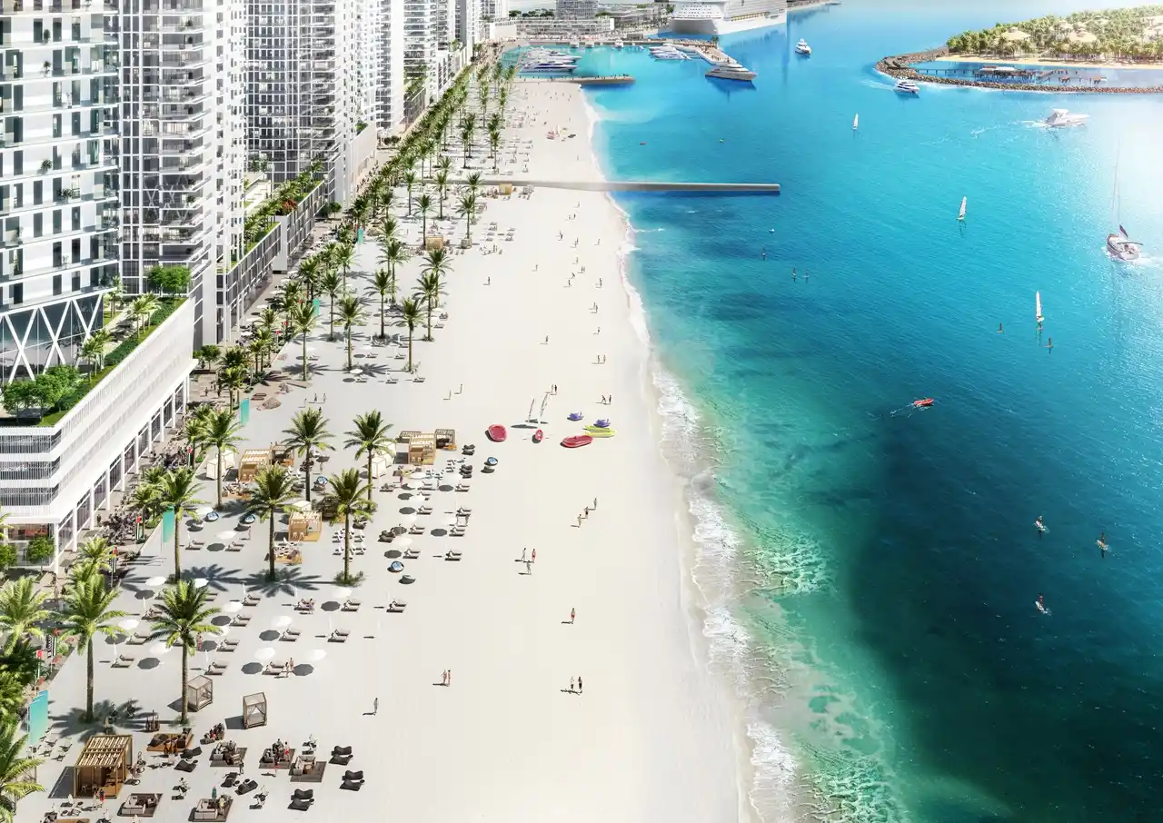 Beach Vista at Emaar Beachfront by Emaar private beach coastline with palm lined promenade sun loungers and clear turquoise water in Dubai - Presented by Tohid Fetrat