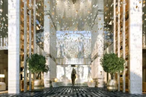Cavalli Tower by DAMAC luxury lobby interior with crystal chandelier installation water feature and modern design in Dubai - Presented by Tohid Fetrat