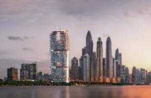 Cavalli Tower by DAMAC waterfront skyline view at sunset with illuminated facade in Dubai - Presented by Tohid Fetrat