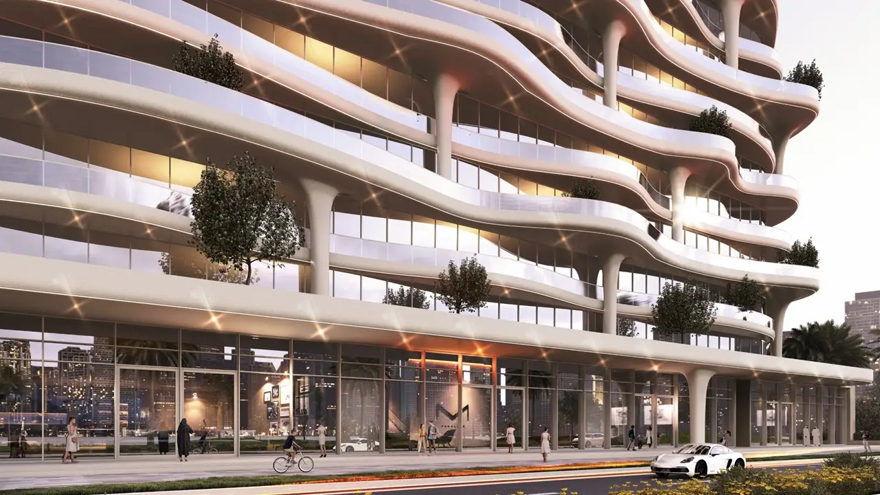 Coralis Grand Residences at Azizi Riviera Meydan building facade with curved balconies and ground level retail frontage in Dubai Presented by Tohid Fetrat