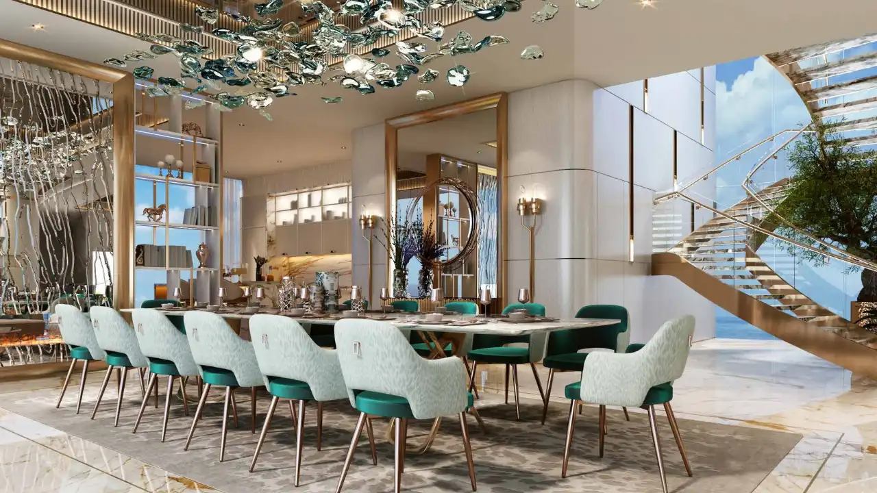 DAMAC Bay by Cavalli luxury dining room with long marble table designer chairs sculptural chandelier and elegant interior design in Dubai - Presented by Tohid Fetrat