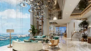 DAMAC Bay by Cavalli luxury penthouse living room with double height ceiling marble flooring chandelier and panoramic sea view in Dubai - Presented by Tohid Fetrat