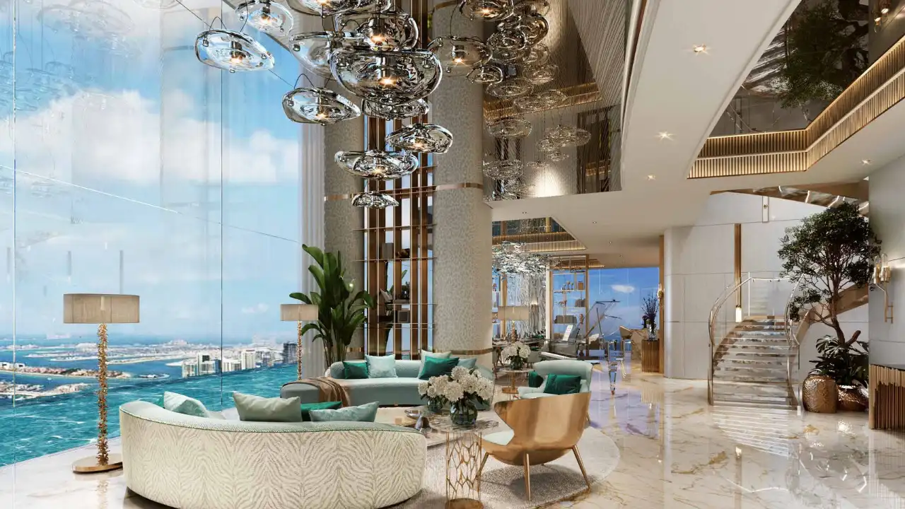 DAMAC Bay by Cavalli luxury penthouse living room with double height ceiling marble flooring chandelier and panoramic sea view in Dubai - Presented by Tohid Fetrat