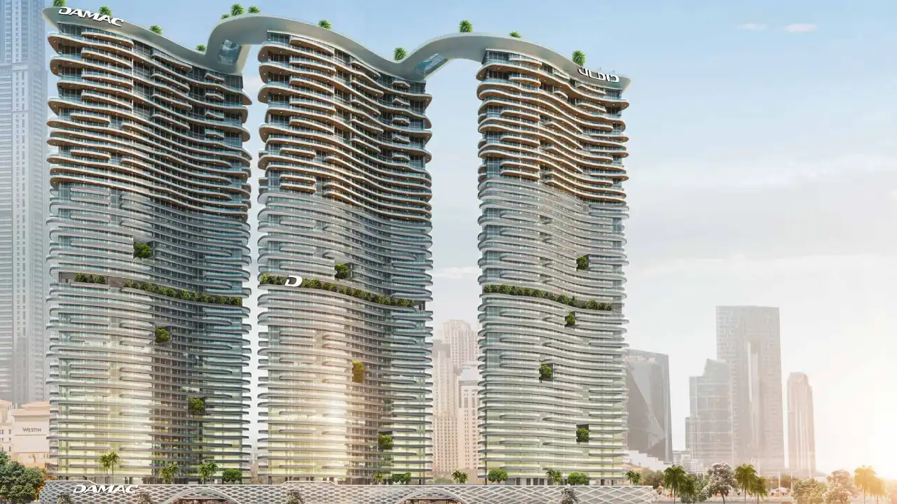 DAMAC Bay by Cavalli luxury waterfront towers with curved glass facades and sky bridge design in Dubai - Presented by Tohid Fetrat
