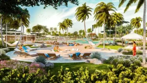 DAMAC Hills 2 by DAMAC Properties beach style lagoon with palm trees sun loungers hammocks and landscaped leisure areas in Dubai - Presented by Tohid Fetrat