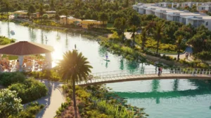 DAMAC Hills 2 by DAMAC Properties lagoon with pedestrian bridge water activities landscaped greenery and waterfront leisure spaces in Dubai - Presented by Tohid Fetrat