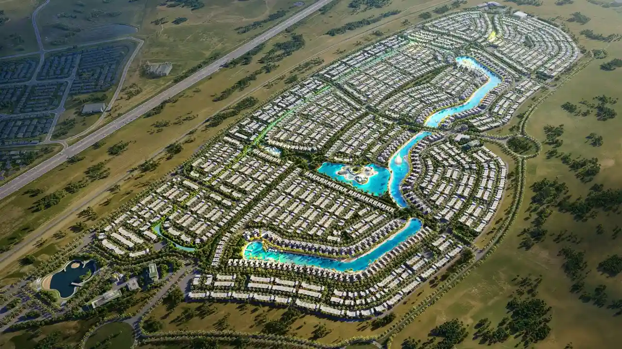 DAMAC Islands by DAMAC Properties aerial masterplan showing full community layout with lagoon network villa clusters and road connectivity in Dubai - Presented by Tohid Fetrat
