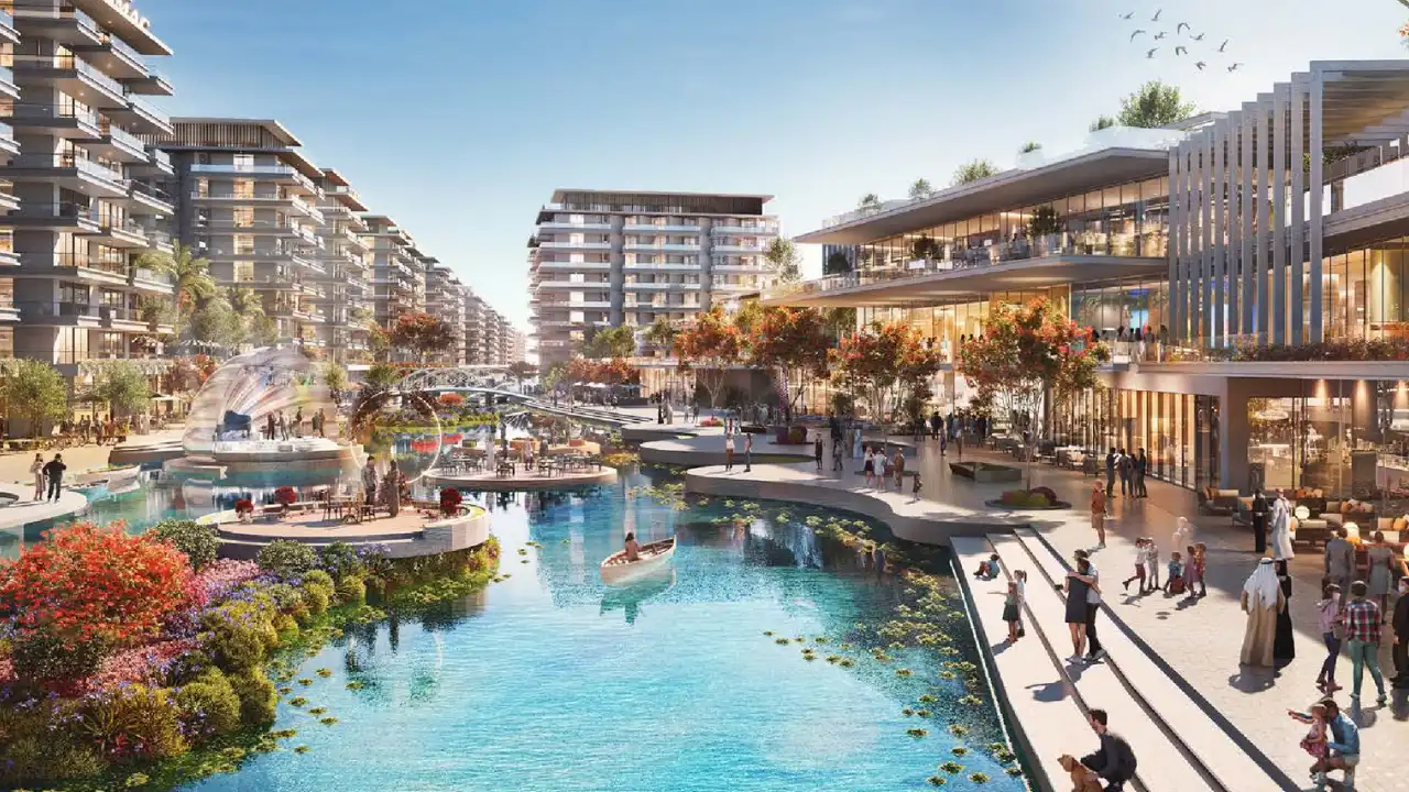 DAMAC Riverside by DAMAC Properties canal front promenade with retail spaces landscaped walkways and modern residential buildings in Dubai - Presented by Tohid Fetrat