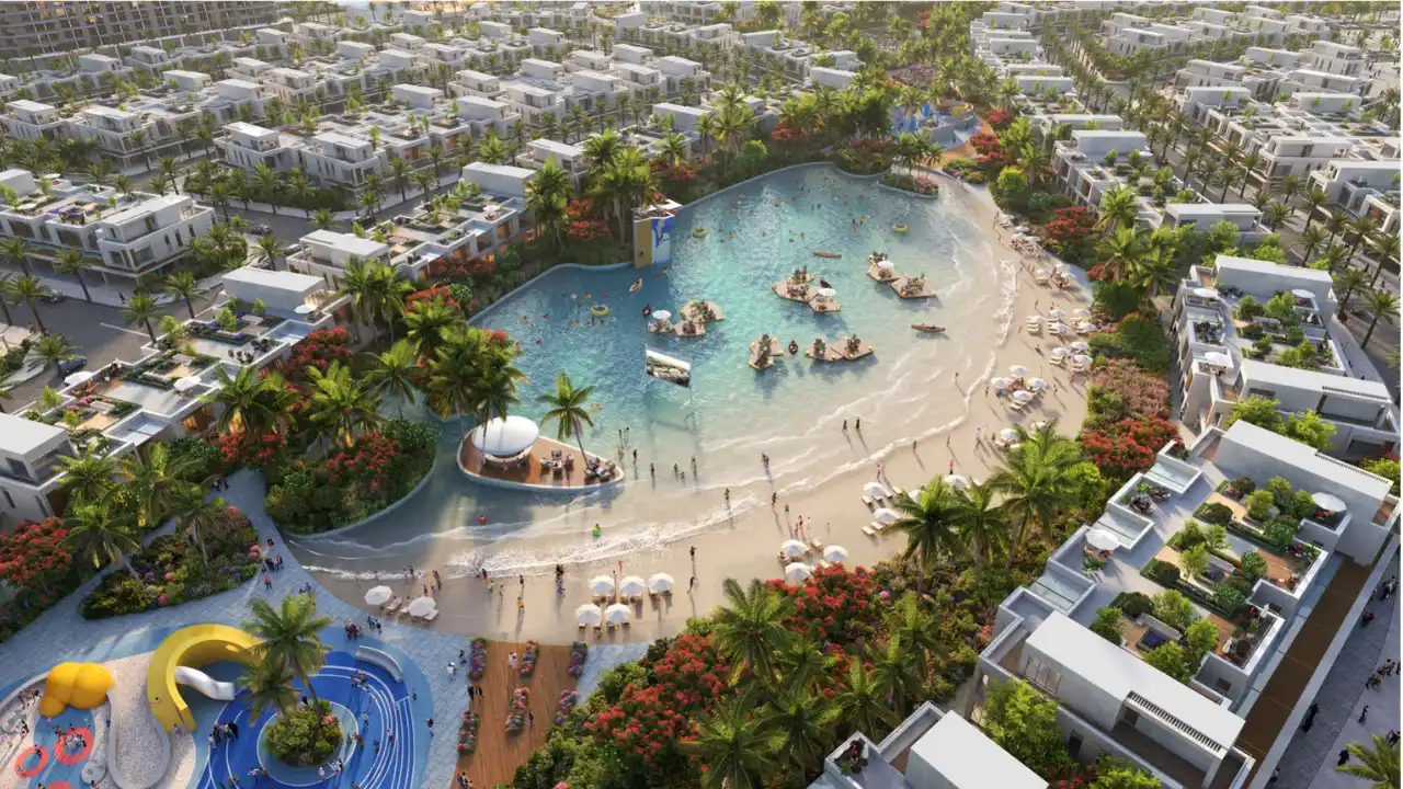 DAMAC Riverside by DAMAC Properties aerial lagoon beach with floating platforms sandy shoreline and surrounding villas in Dubai - Presented by Tohid Fetrat