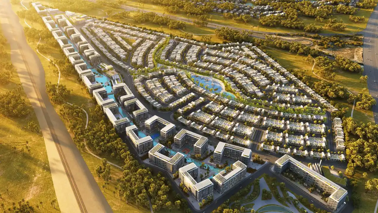 DAMAC Riverside by DAMAC Properties aerial master plan showing canal residences villa clusters central lagoon and landscaped community layout in Dubai - Presented by Tohid Fetrat