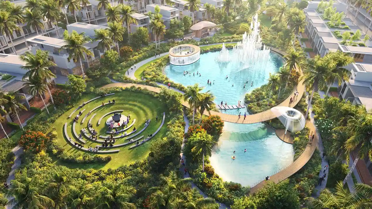DAMAC Sun City by DAMAC Properties lagoon with fountain amphitheatre seating landscaped gardens and walking paths in Dubai - Presented by Tohid Fetrat