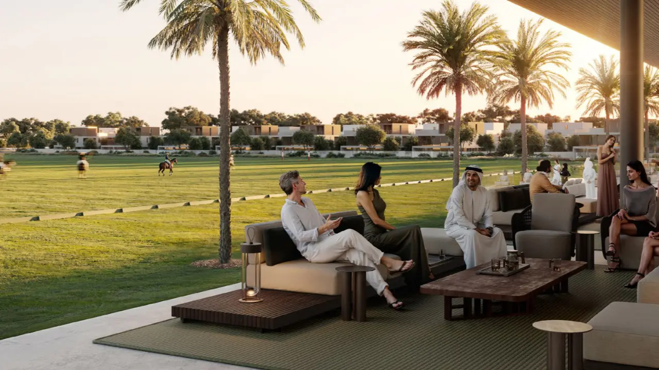 Equiterra at Grand Polo Club and Resort by Emaar open polo lounge with outdoor seating palm trees and field views in Dubai - Presented by Tohid Fetrat