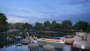 Equiterra at Grand Polo Club and Resort by Emaar rooftop terrace with firepit lounge seating landscaped views and evening ambiance in Dubai - Presented by Tohid Fetrat
