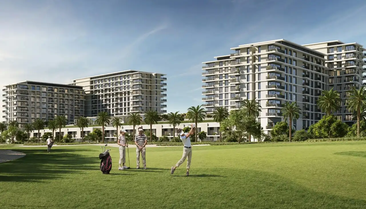 Golf Hills at Emaar South by Emaar residential buildings overlooking golf course with players and landscaped greenery in Dubai - Presented by Tohid Fetrat