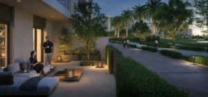 Golf Hills at Emaar South by Emaar private terrace with seating area overlooking landscaped pathways and greenery at evening in Dubai - Presented by Tohid Fetrat