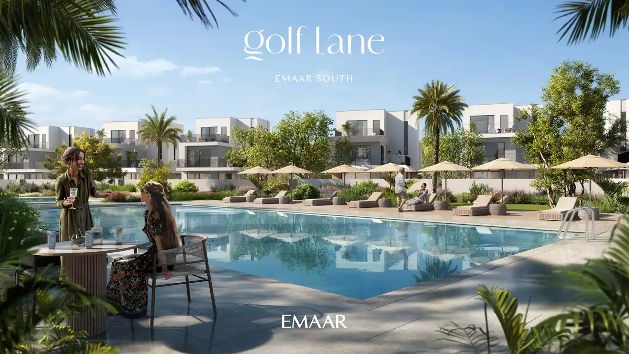 Golf Lane at Emaar South by Emaar community swimming pool with sun loungers palm trees and modern villas in Dubai - Presented by Tohid Fetrat