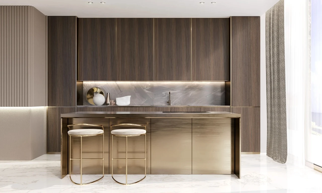 Grand Bleu Tower at Emaar Beachfront by Emaar modern kitchen with gold finish island bar stools marble backsplash and wood cabinetry in Dubai - Presented by Tohid Fetrat