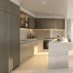Grand Bleu Tower at Emaar Beachfront by Emaar modern kitchen with marble island wood cabinetry and integrated appliances in Dubai - Presented by Tohid Fetrat