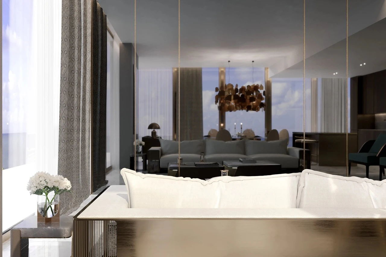 Grand Bleu Tower at Emaar Beachfront by Emaar modern living room with plush seating designer chandelier and floor to ceiling windows in Dubai - Presented by Tohid Fetrat