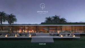 Grand Polo Club & Resort by Emaar clubhouse terrace with outdoor seating and palm trees at evening in Dubai - Presented by Tohid Fetrat