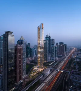 LUMENA by Omniyat office tower full exterior view rising above Dubai skyline with Sheikh Zayed Road and surrounding skyscrapers at dusk - Presented by Tohid Fetrat