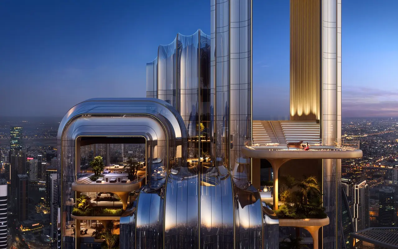 LUMENA by Omniyat office tower rooftop terrace with lounge seating and illuminated architectural facade overlooking Dubai skyline at night - Presented by Tohid Fetrat