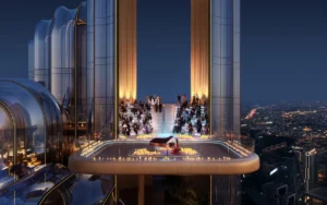 LUMENA by Omniyat office tower sky terrace event space with piano performance and illuminated seating overlooking Dubai at night - Presented by Tohid Fetrat