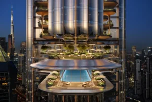 LUMENA by Omniyat office tower sky terrace with pool lounge and landscaped seating overlooking Dubai skyline at night - Presented by Tohid Fetrat