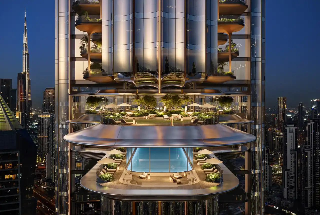 LUMENA by Omniyat office tower sky terrace with pool lounge and landscaped seating overlooking Dubai skyline at night - Presented by Tohid Fetrat