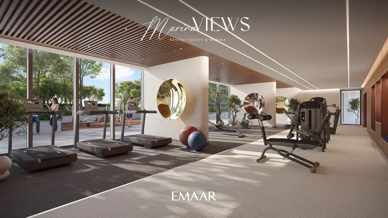 Marina Views at Rashid Yachts and Marina by Emaar modern gym with treadmills fitness equipment and large windows overlooking landscaped outdoor area in Dubai - Presented by Tohid Fetrat